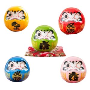 daruma porte bonheur japonais sur coussin 9 cm